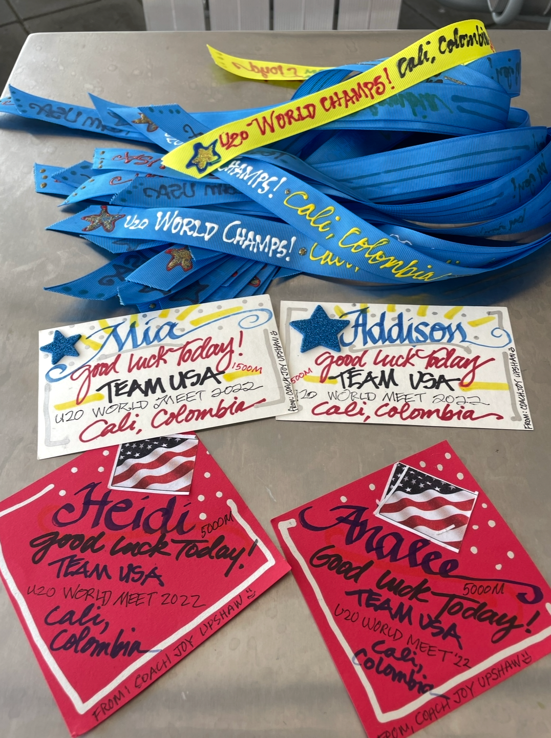 Hand painted ribbons and good luck cards Joy made for young Team USA athletes competing in Cali, Colombia